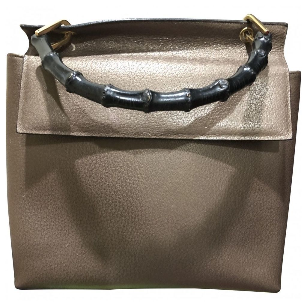 Bamboo patent leather handbag