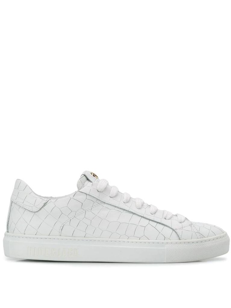 embossed low top trainers