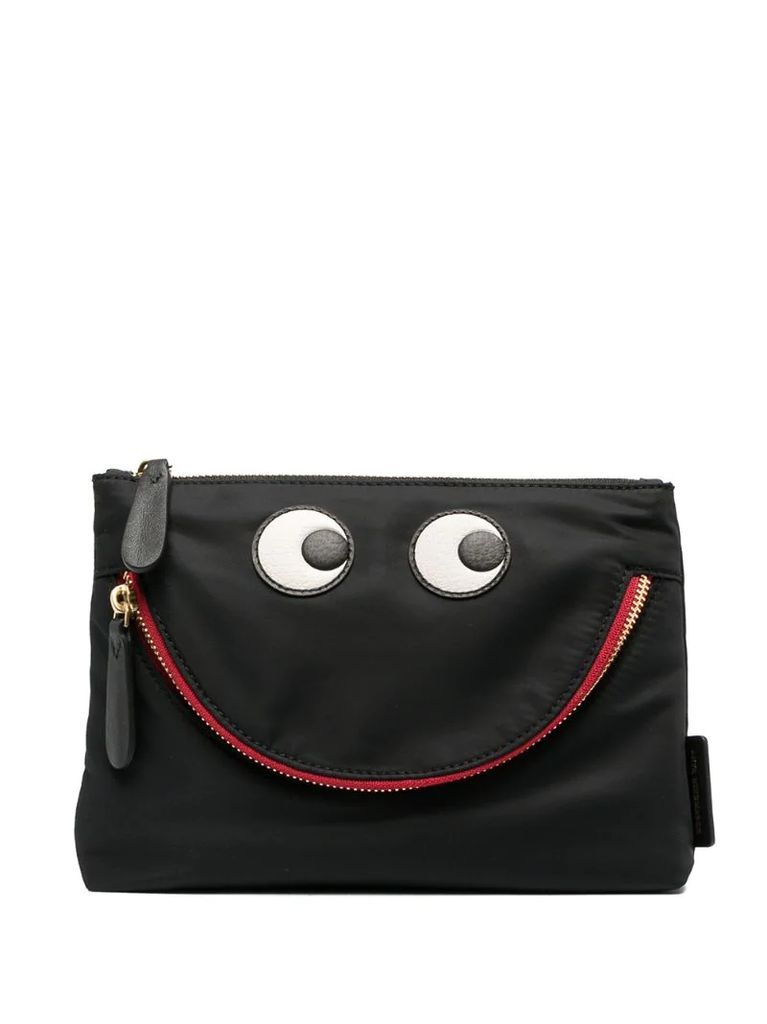 Eyes zipped clutch bag