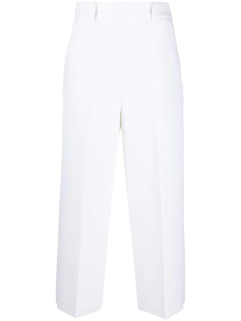 pressed-crease cropped trousers