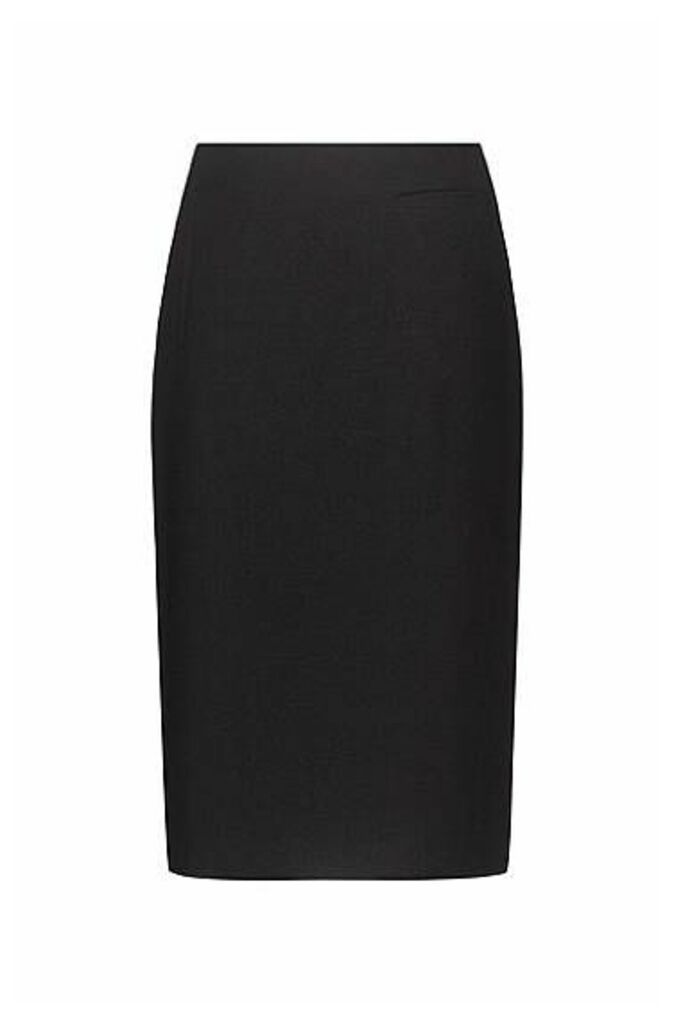 Stretch-fabric pencil skirt with piped pockets