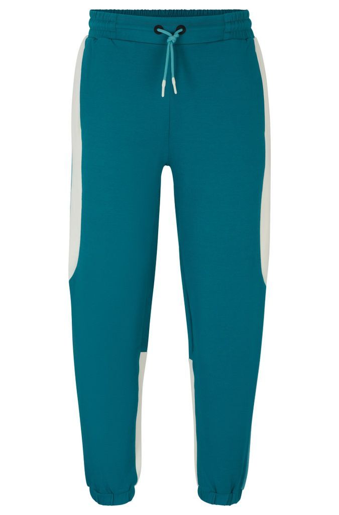 Baggy-fit tracksuit bottoms in stretch fabric