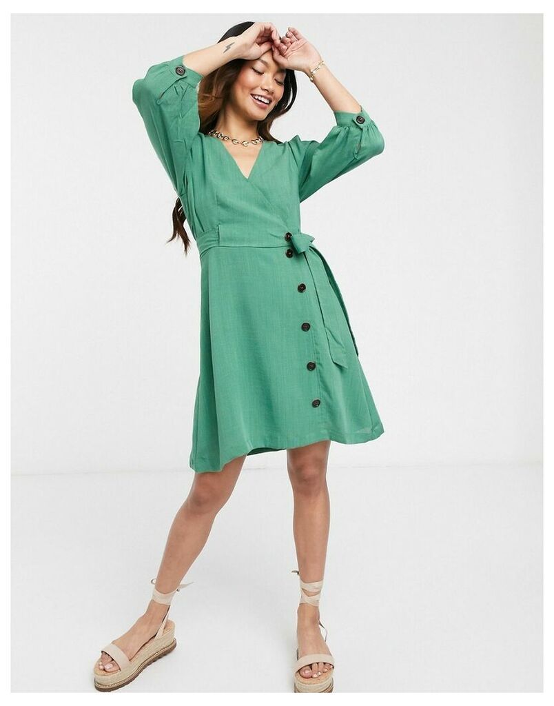 mini wrap dress with button detail in green