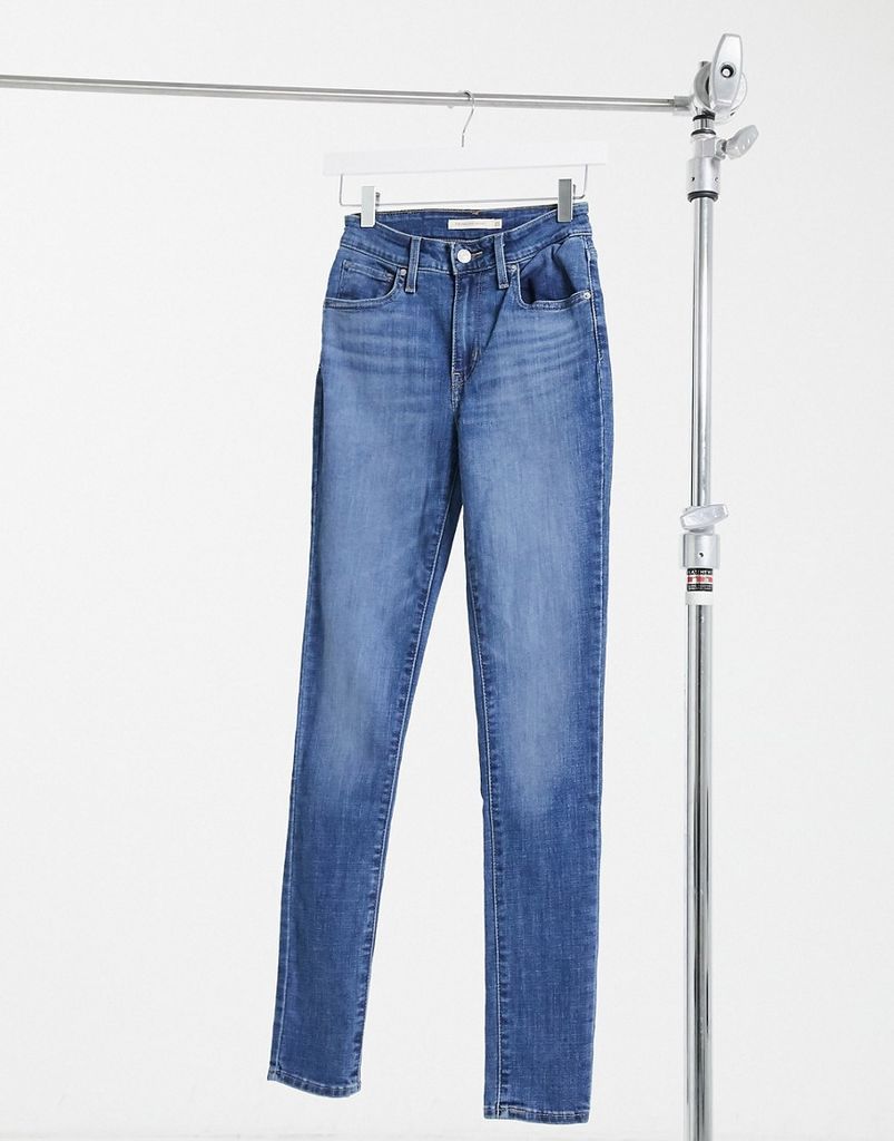 721 high rise skinny jeans in mid wash blue