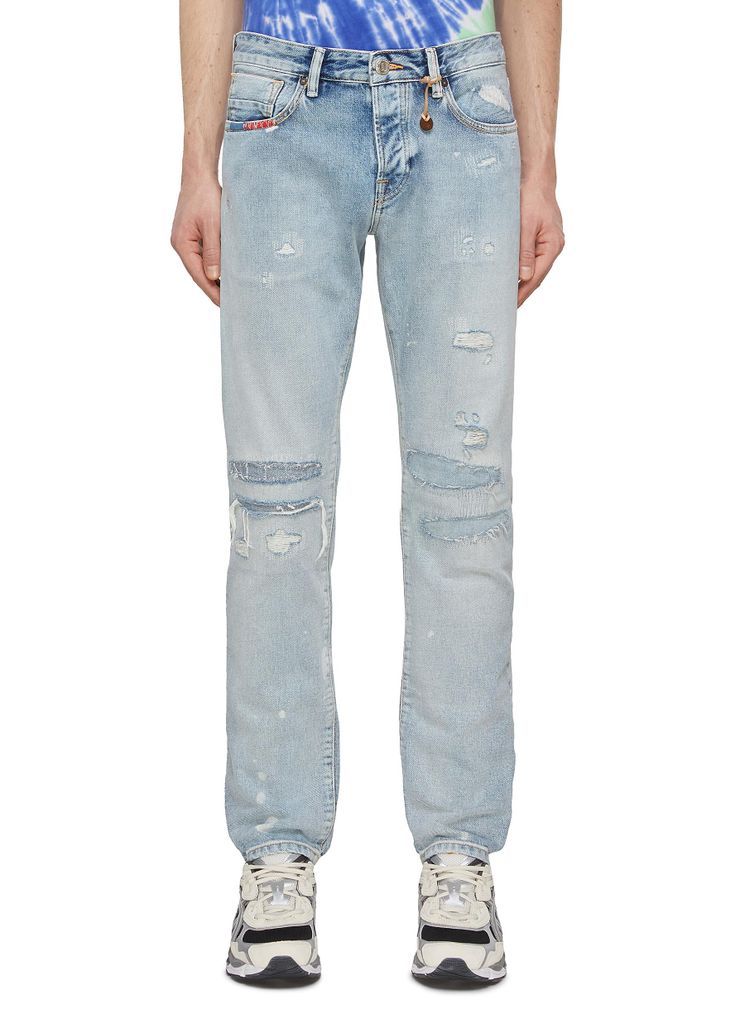 Ripped And Repaired Washed Slim Jeans