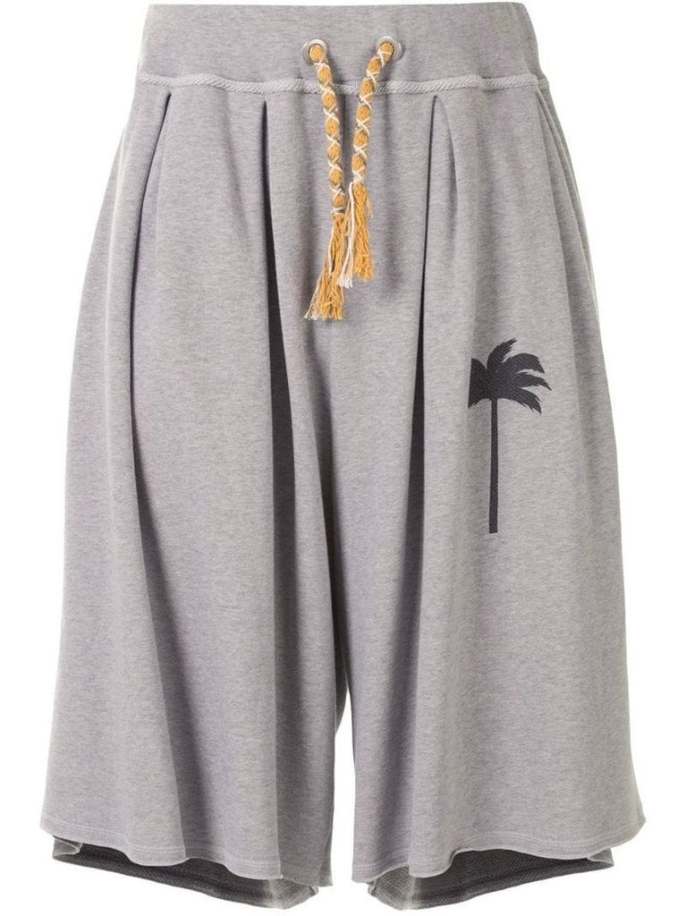 palm-motif track shorts