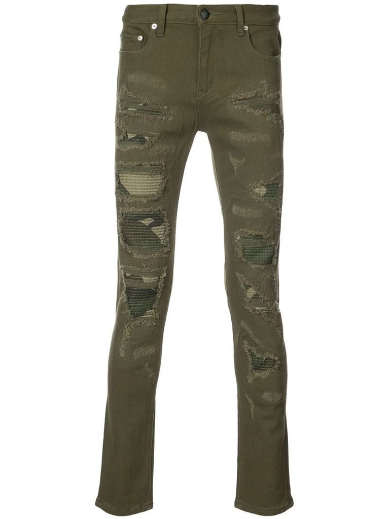 Distressed camouflage panel jeans