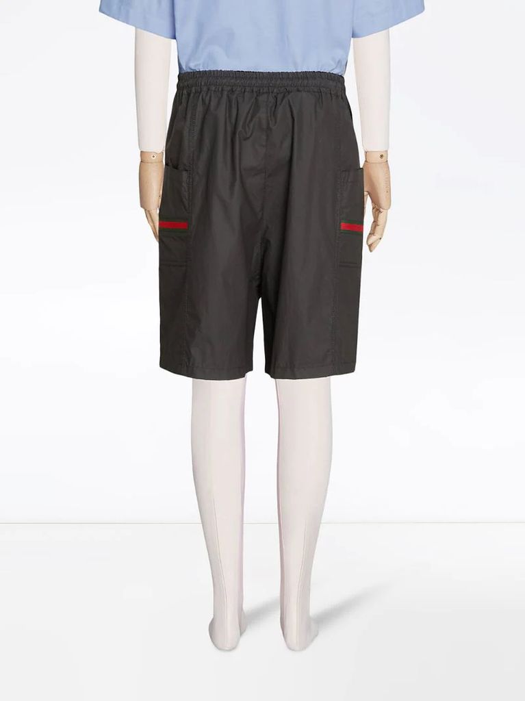Web-embellished knee-length shorts