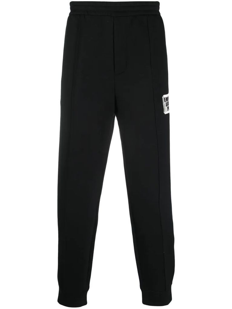 embroidered patch tapered trousers