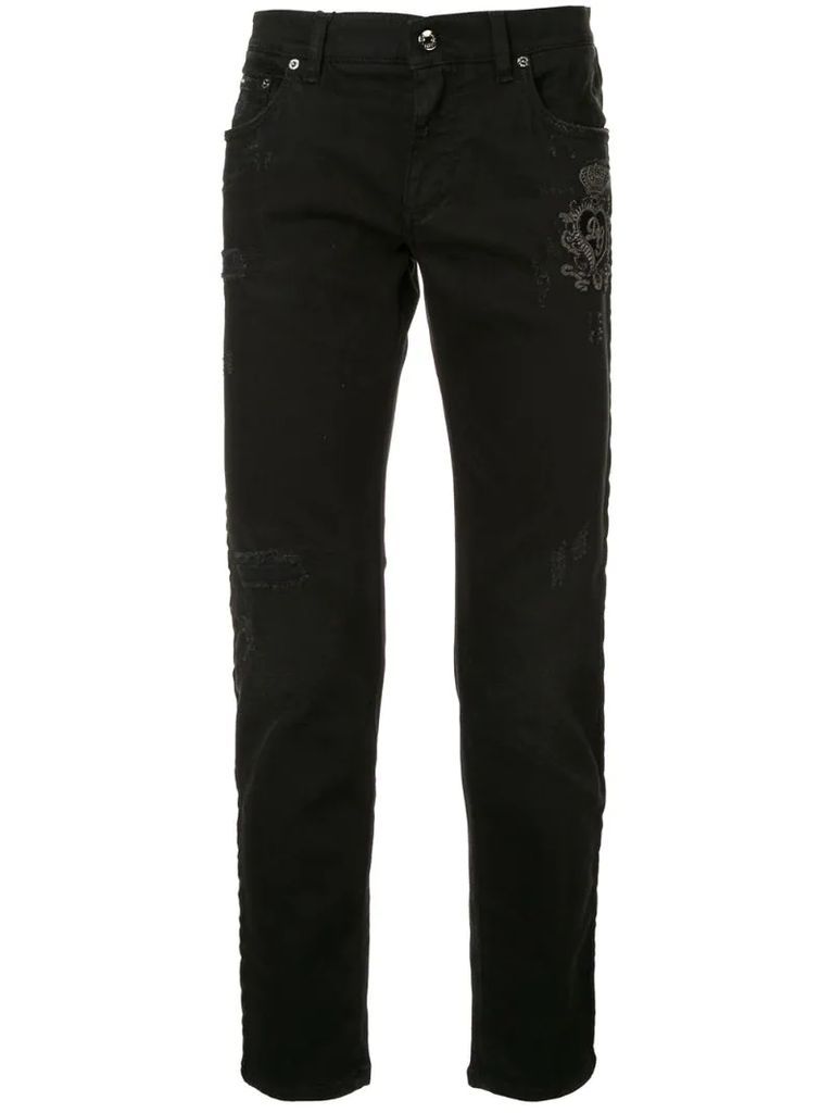 distressed logo patch jeans