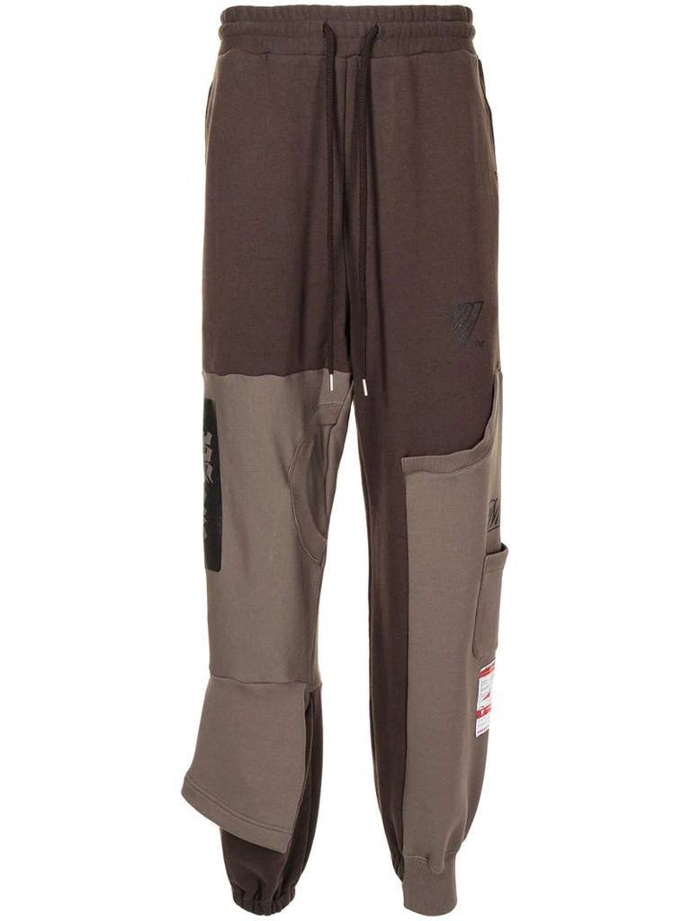 layered two-tone track pants
