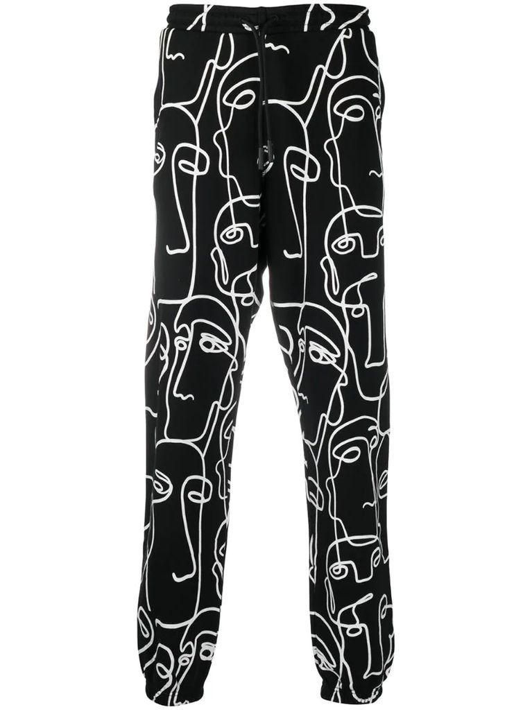 all-over Faces print track pants