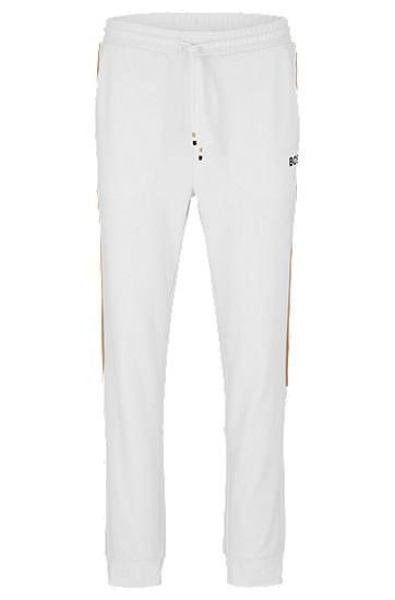 Tracksuit bottoms in active-stretch fabric with side stripes