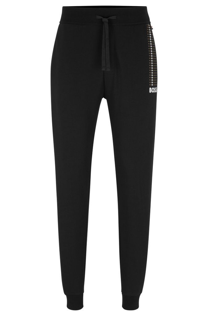 Cotton-terry tracksuit bottoms with dot stripes and logo