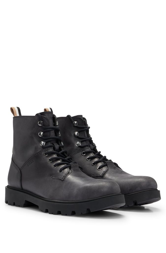 Half boots in pull-up leather with embossed logo
