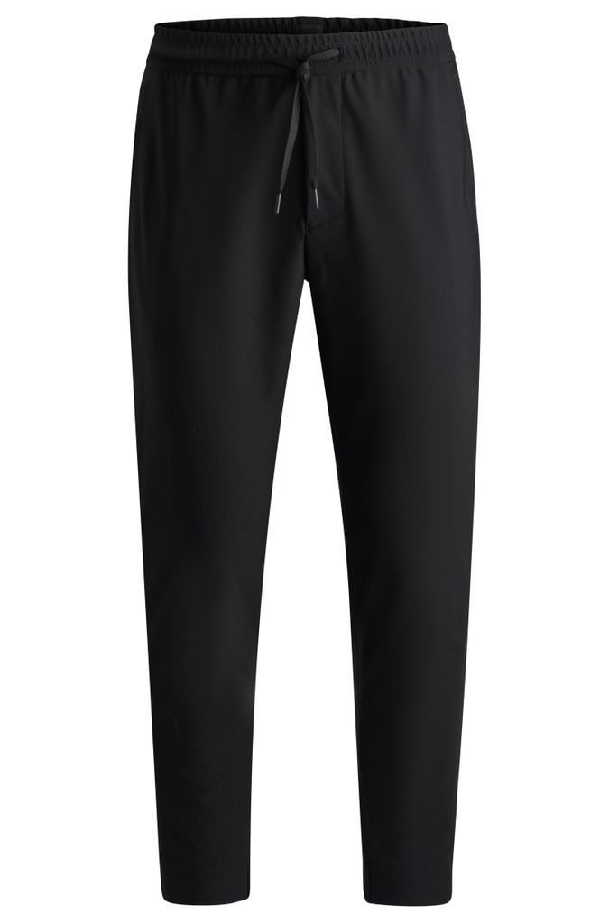 Tapered-fit trousers in waterproof softshell material